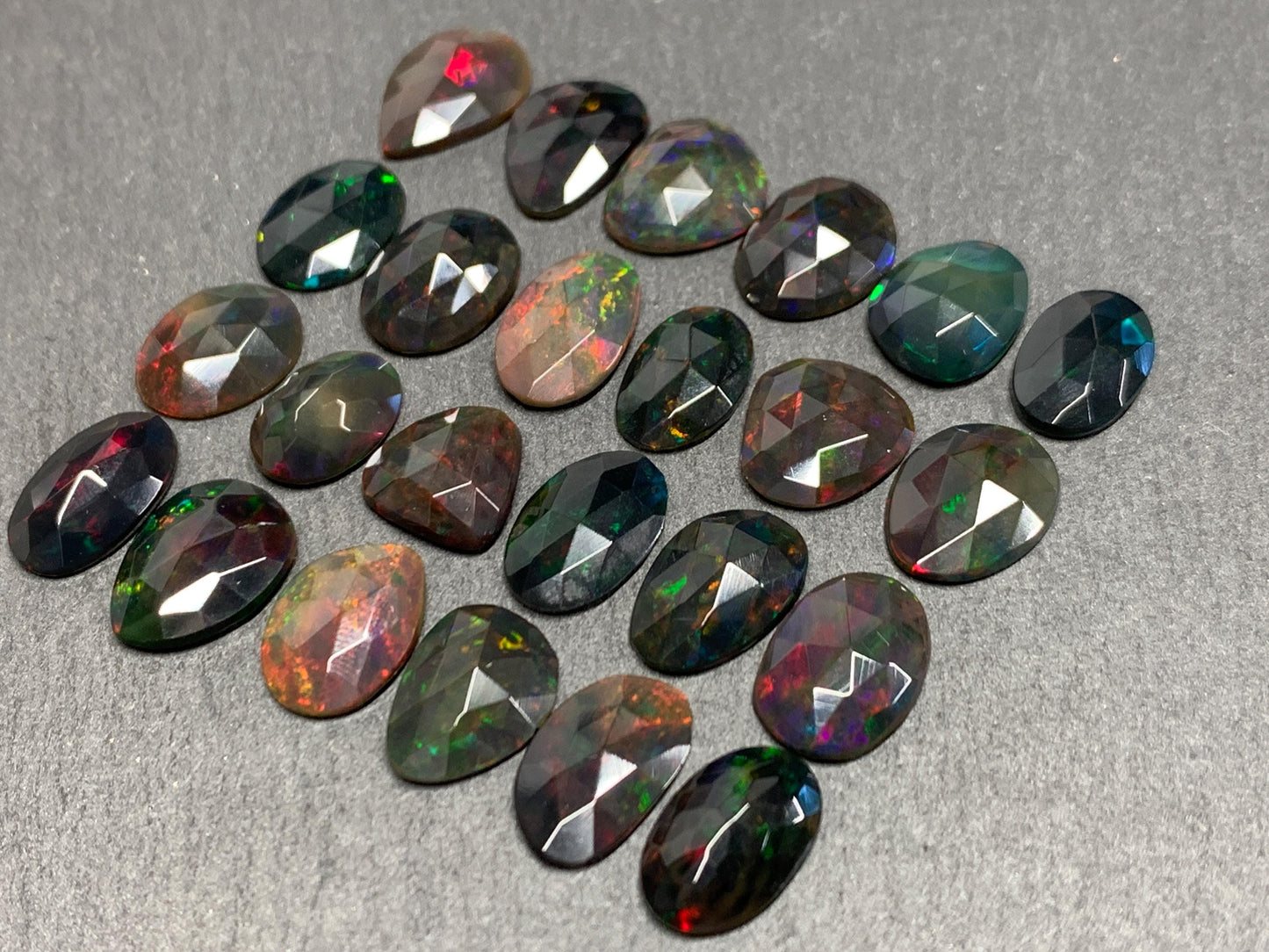 Faceted Black Ethiopian Opal 10-13mm long cabochon
