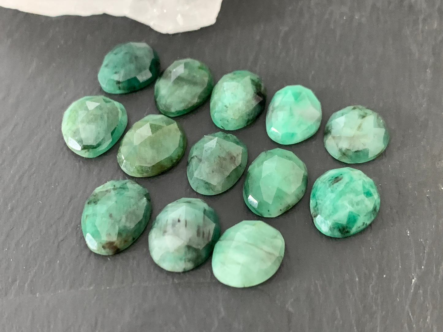 Faceted Emerald oval 12-13mm cabochon