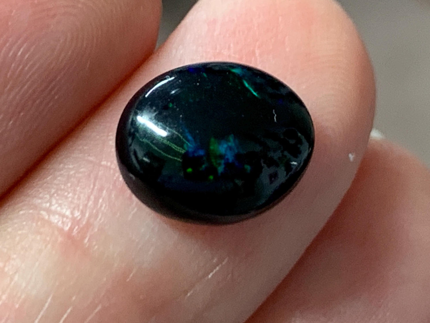 Natural Ethiopian Black Opal 9x11x4mm cabochon