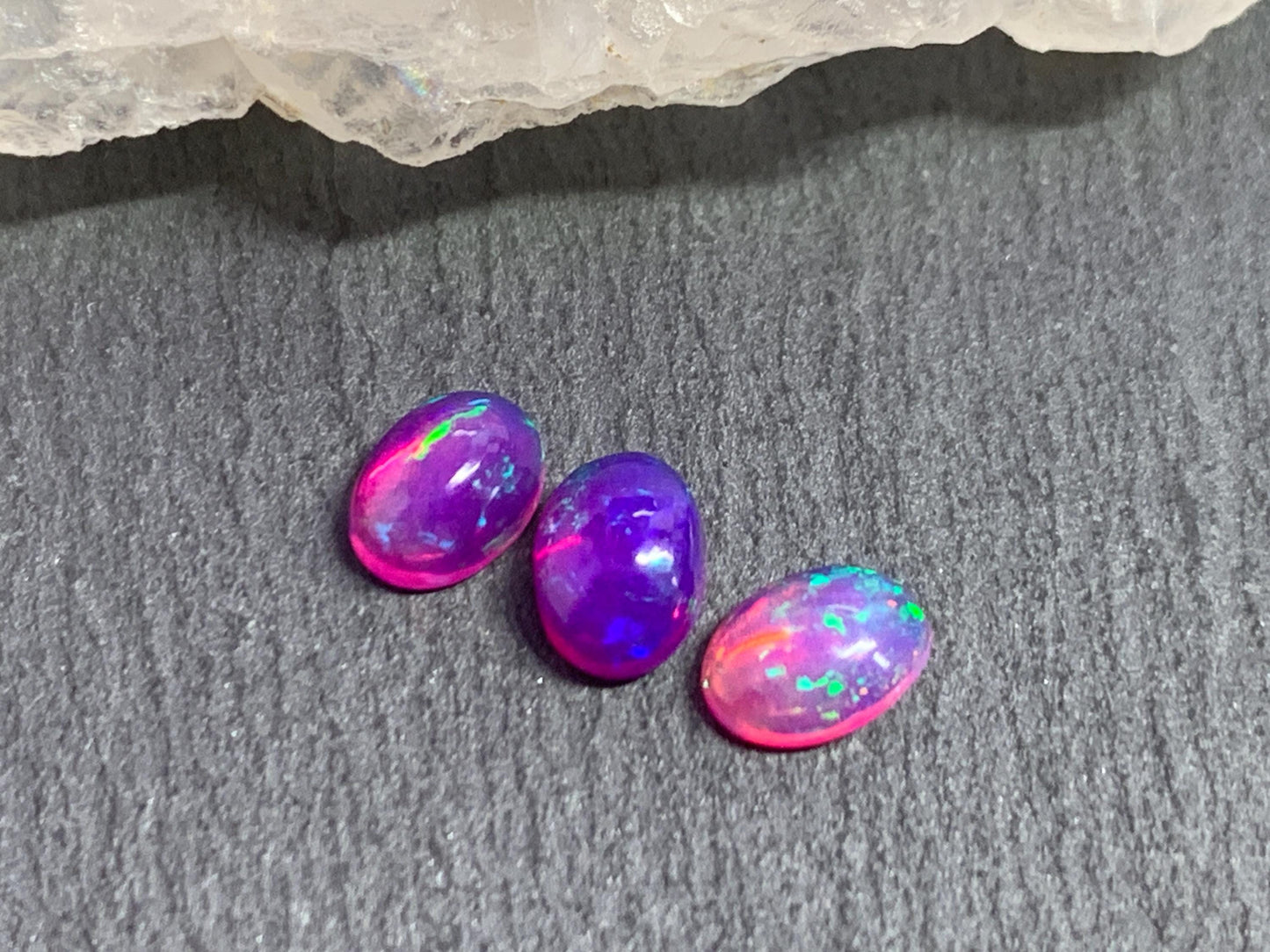 Ethiopian Opal oval 5x7mm cabochon - Natural Opal smoked to purple color