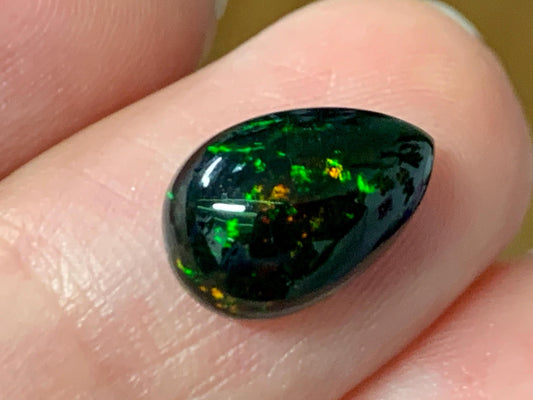 Natural Ethiopian Black Opal 8x12x4mm cabochon