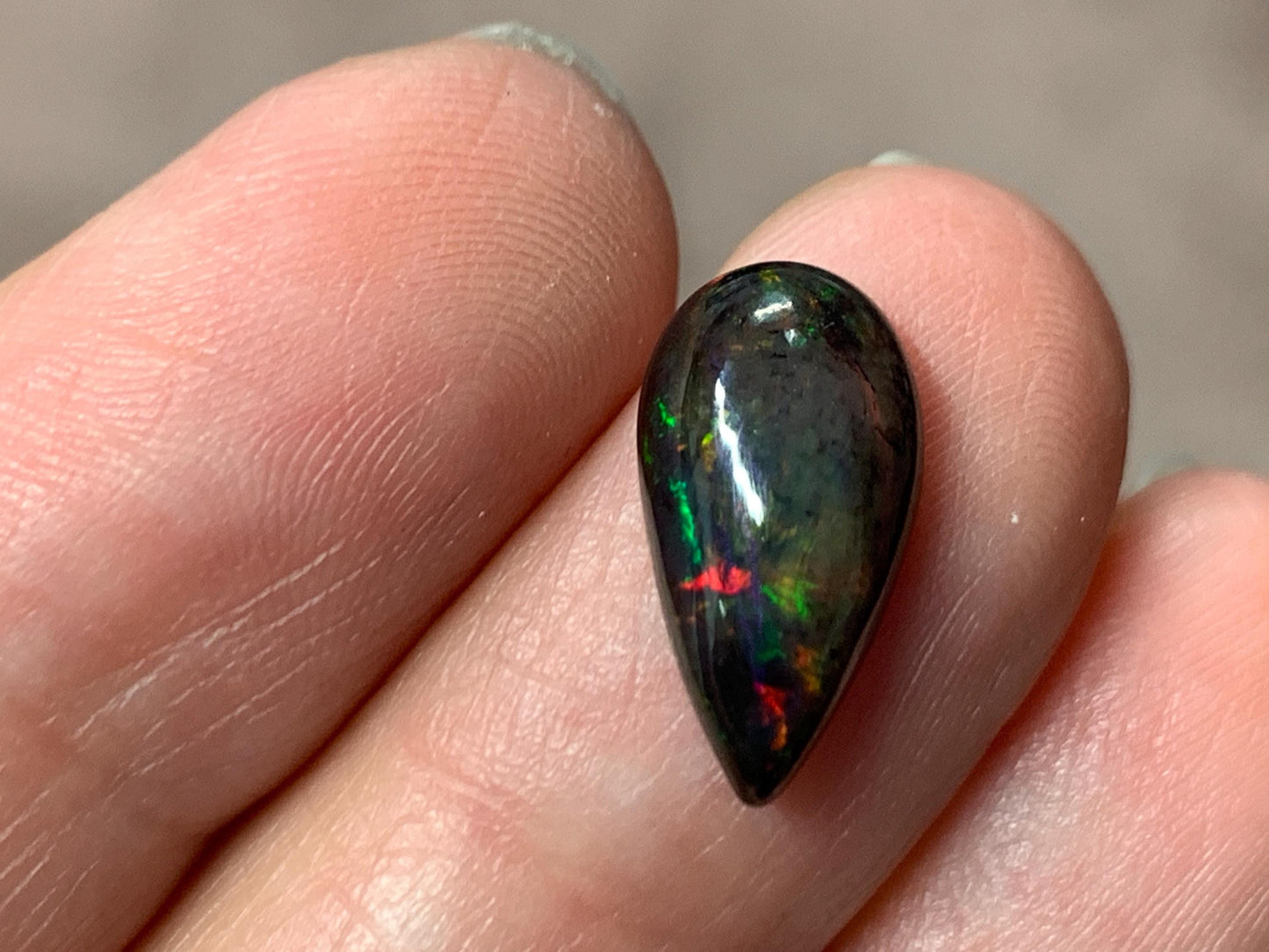 Black Ethiopian Opal pear 7x14x4mm cabochon
