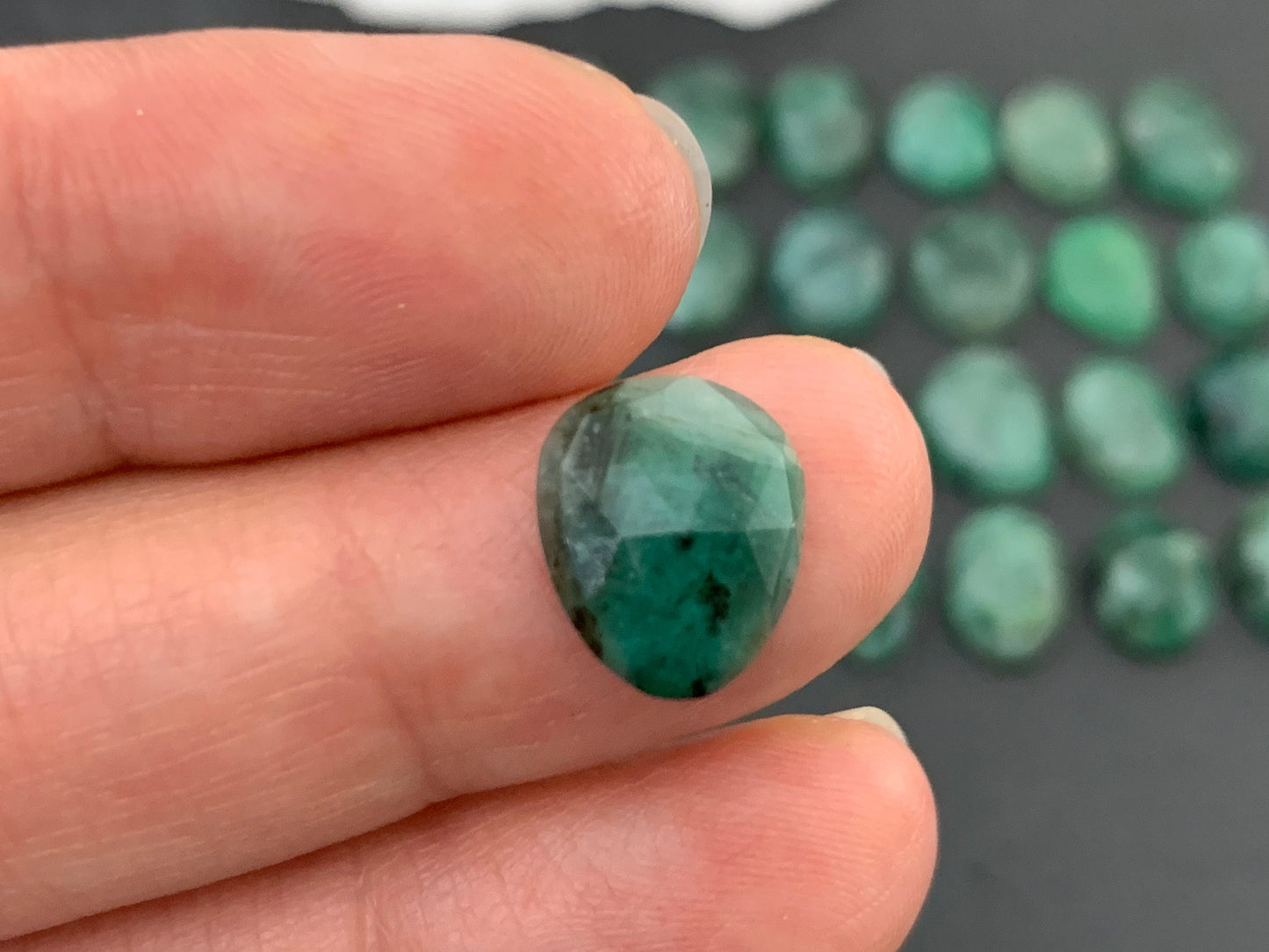 Faceted Emerald oval 11-13mm long cabochon