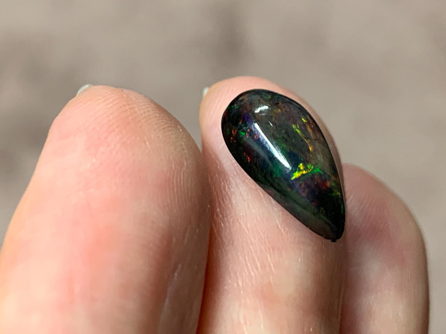 Black Ethiopian Opal pear 7x14x4mm cabochon