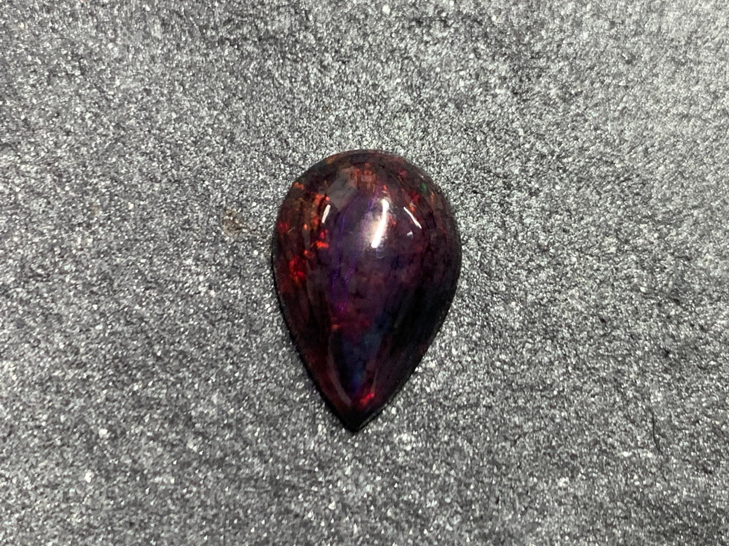Black Ethiopian Opal pear 8x13x4mm cabochon