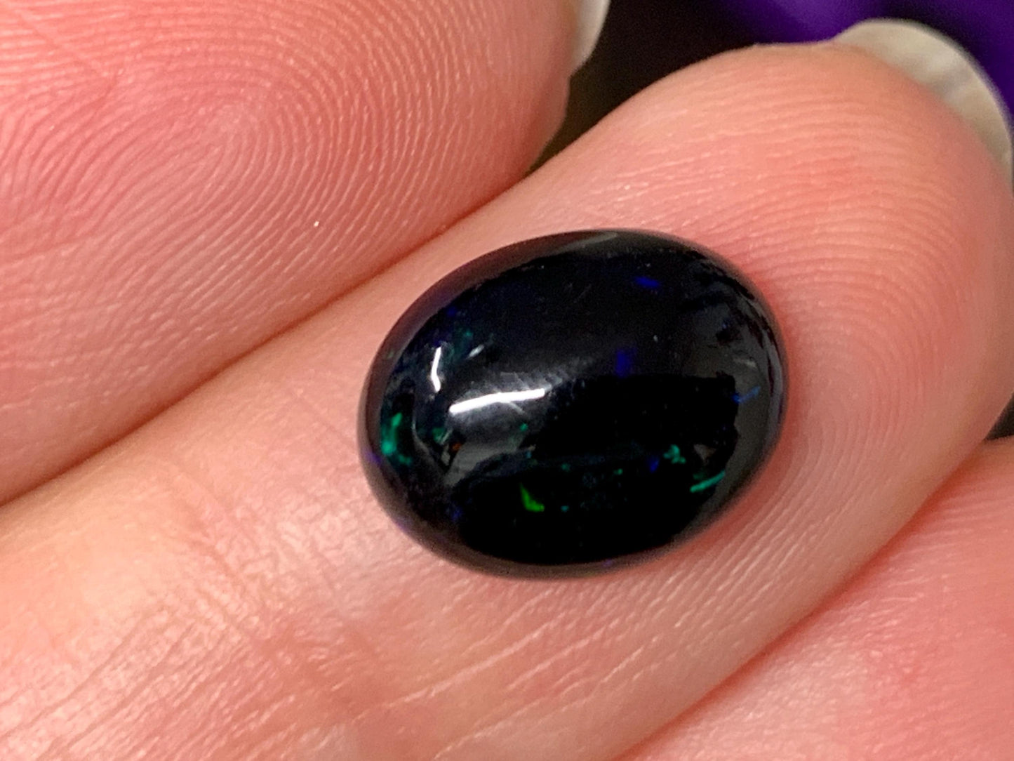Natural Ethiopian Black Opal 9x11x4mm cabochon