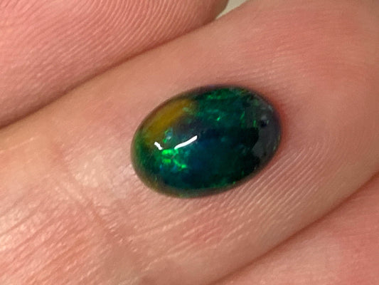 Natural Ethiopian Black Opal 6x9x3mm cabochon