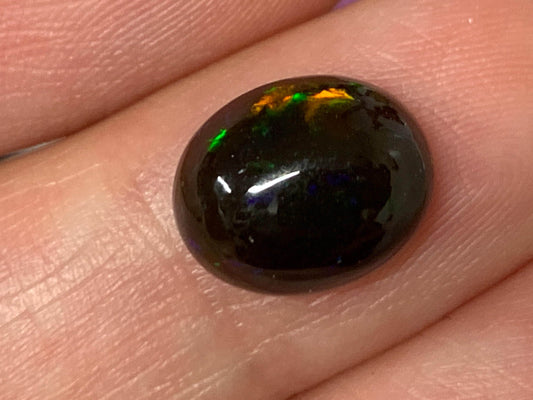 Natural Ethiopian Black Opal 9x11x5mm cabochon