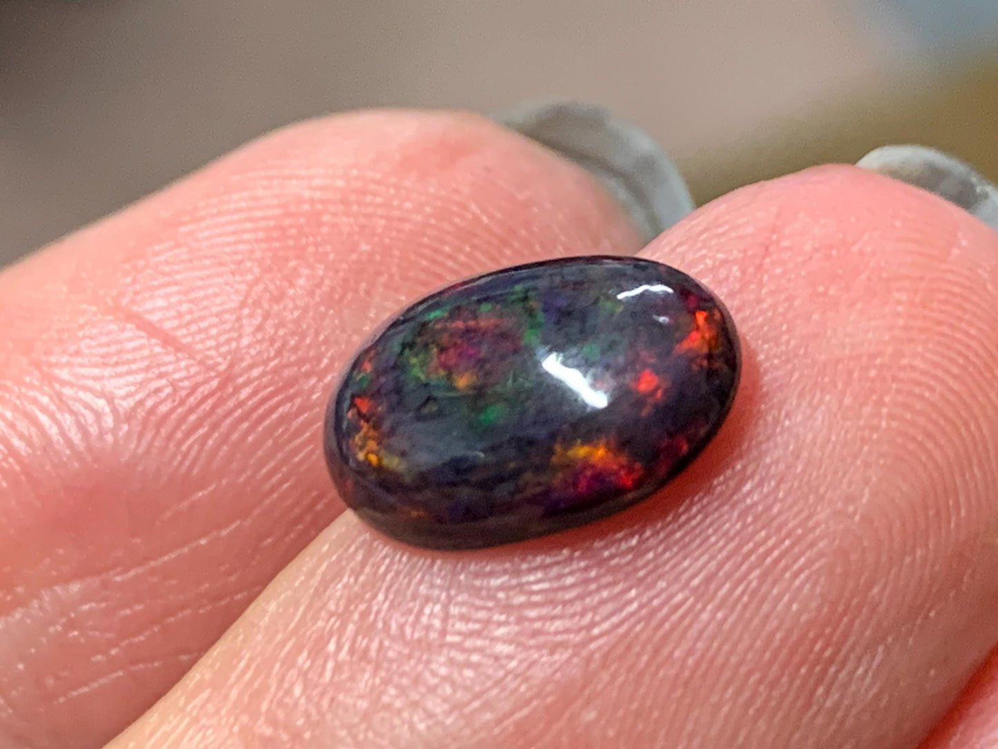 Natural Ethiopian Black Opal 9x11x5mm cabochon