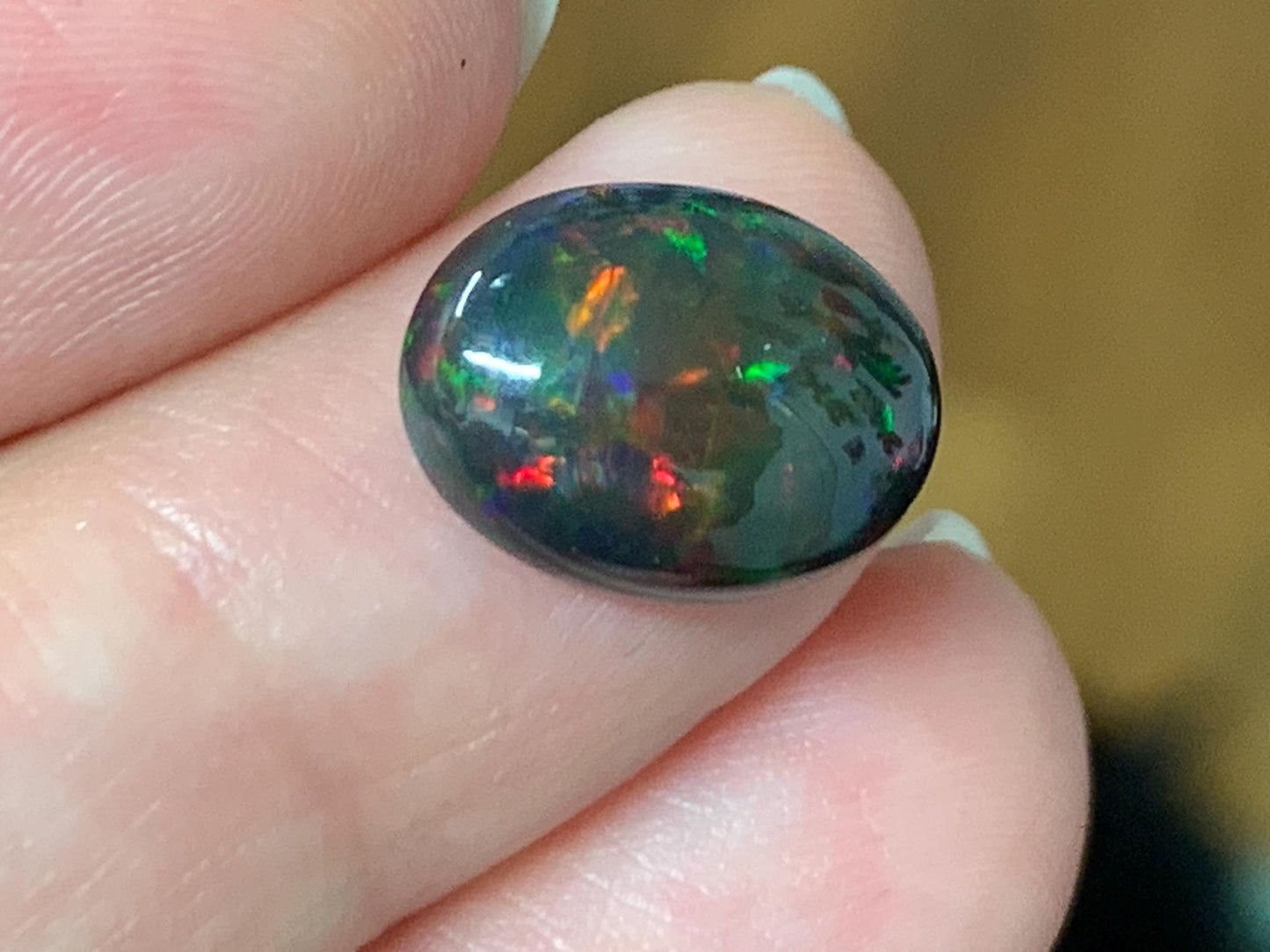 Natural Ethiopian Black Opal 10x13x5mm cabochon