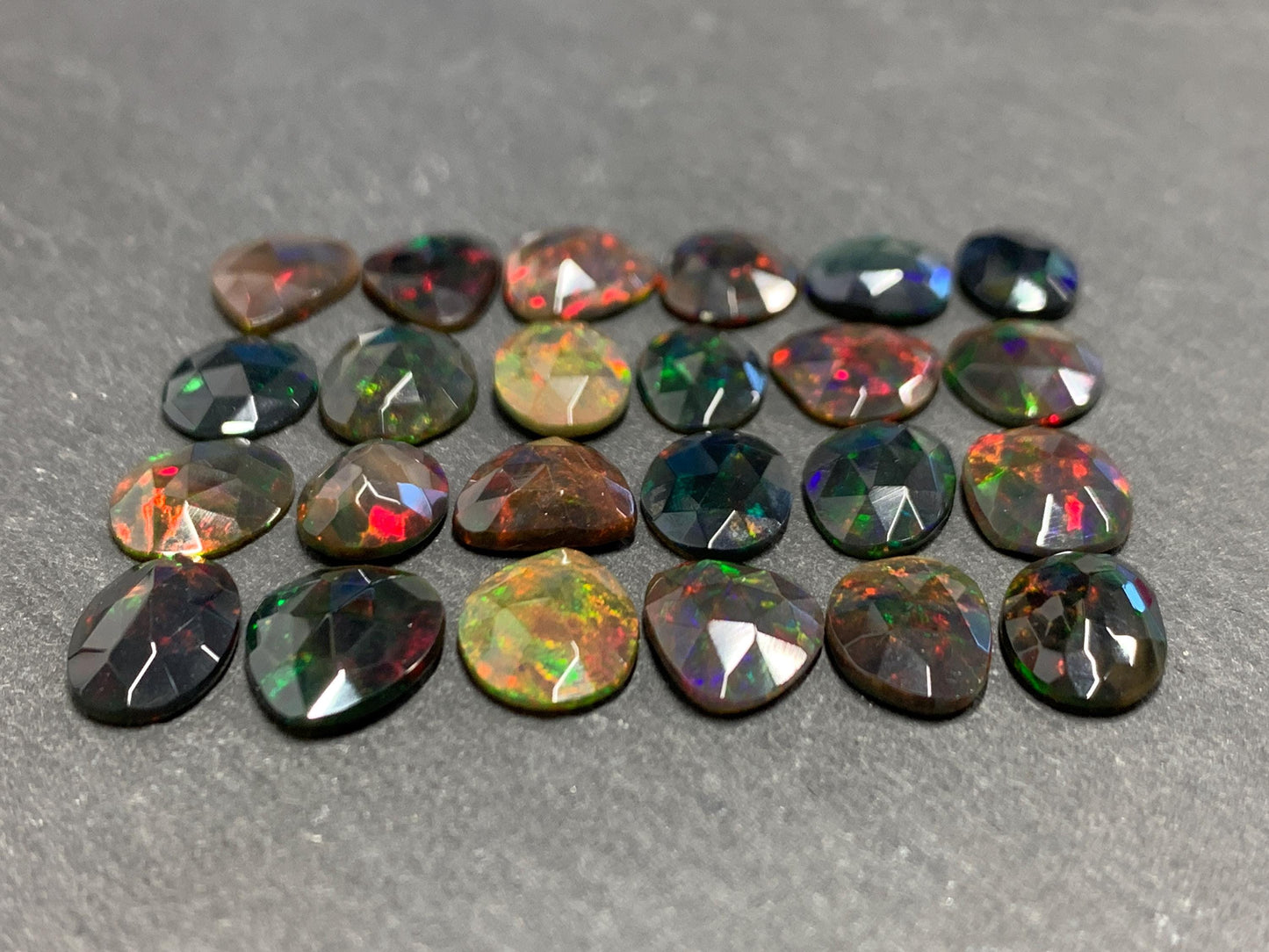 Faceted Black Ethiopian Opal 10-13mm long cabochon
