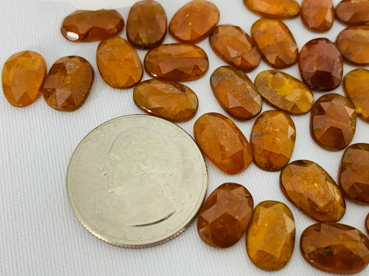 Faceted orange Kyanite oval 7x12mm cabochons