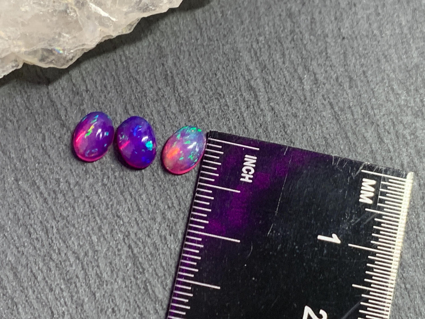Ethiopian Opal oval 5x7mm cabochon - Natural Opal smoked to purple color
