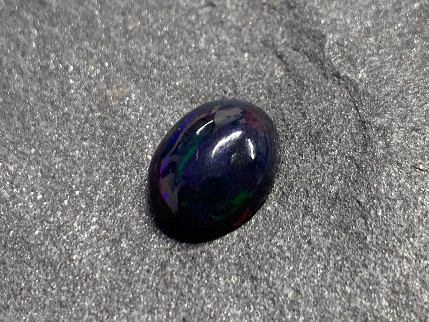 Black Ethiopian Opal oval 9x11x4mm cabochon