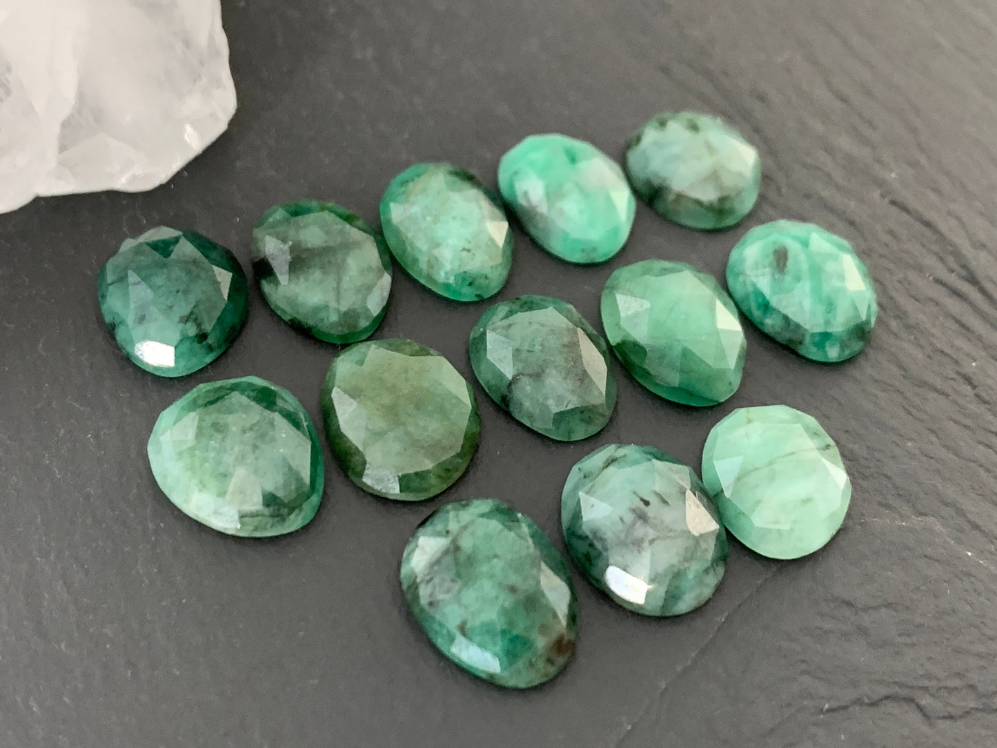 Faceted Emerald oval 12-13mm cabochon