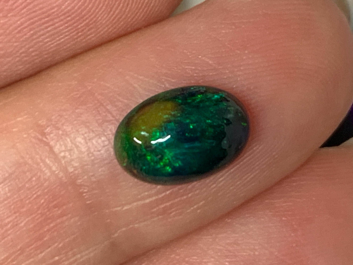 Natural Ethiopian Black Opal 6x9x3mm cabochon