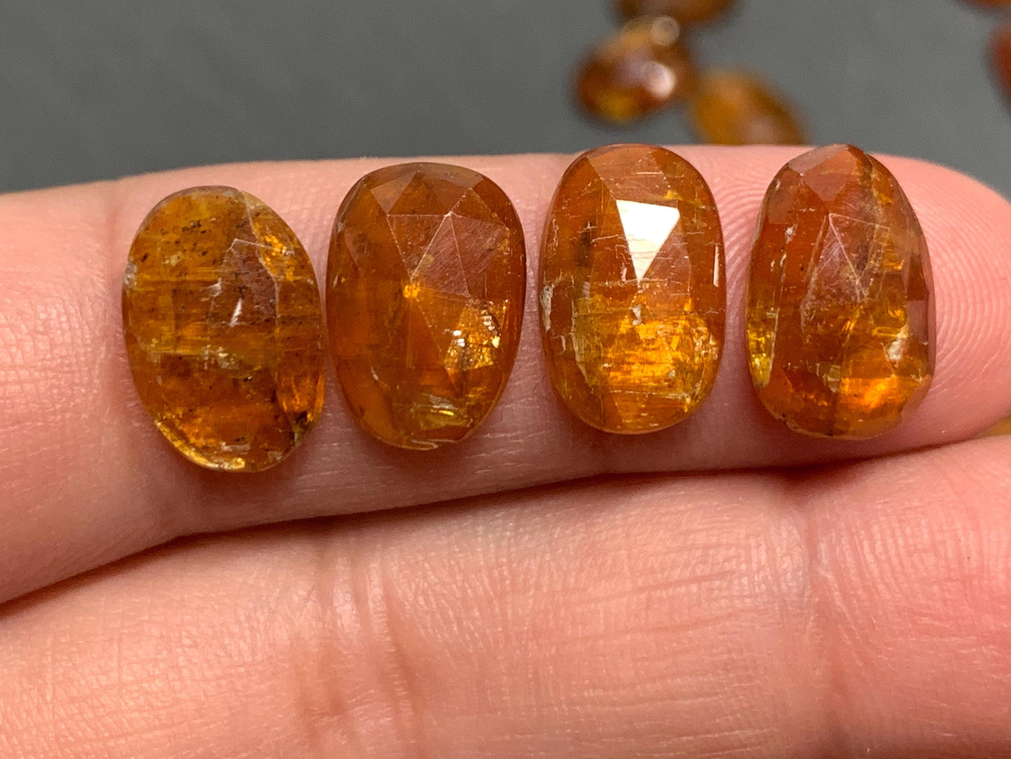 Damaged - faceted orange Kyanite oval 13mm long cabochons