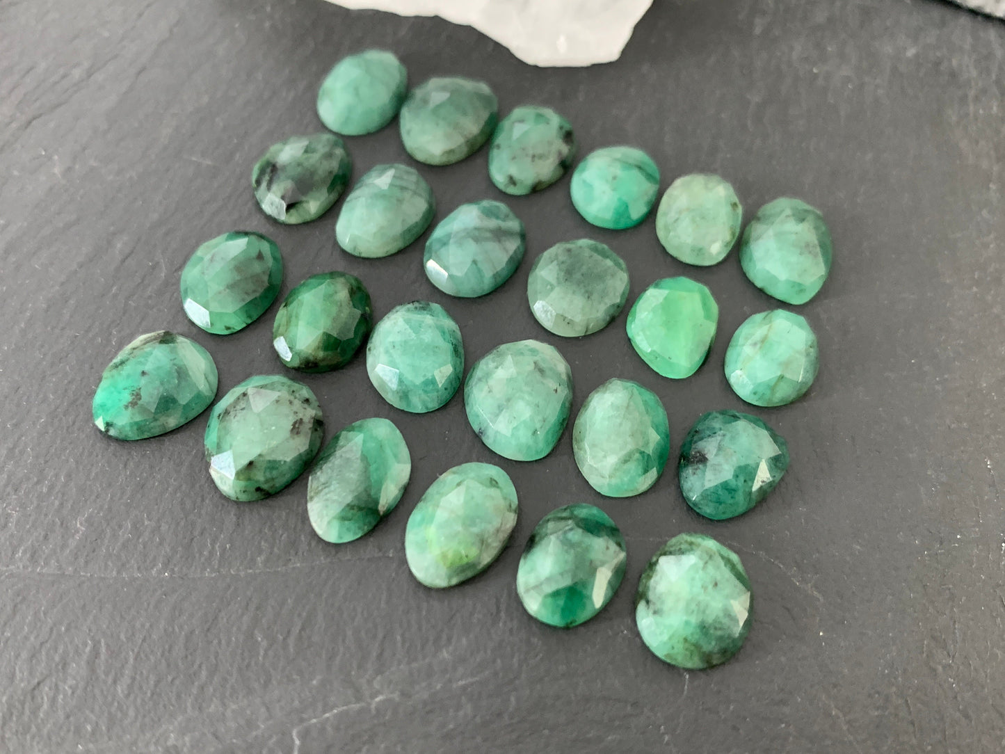 Faceted Emerald oval 11-13mm long cabochon