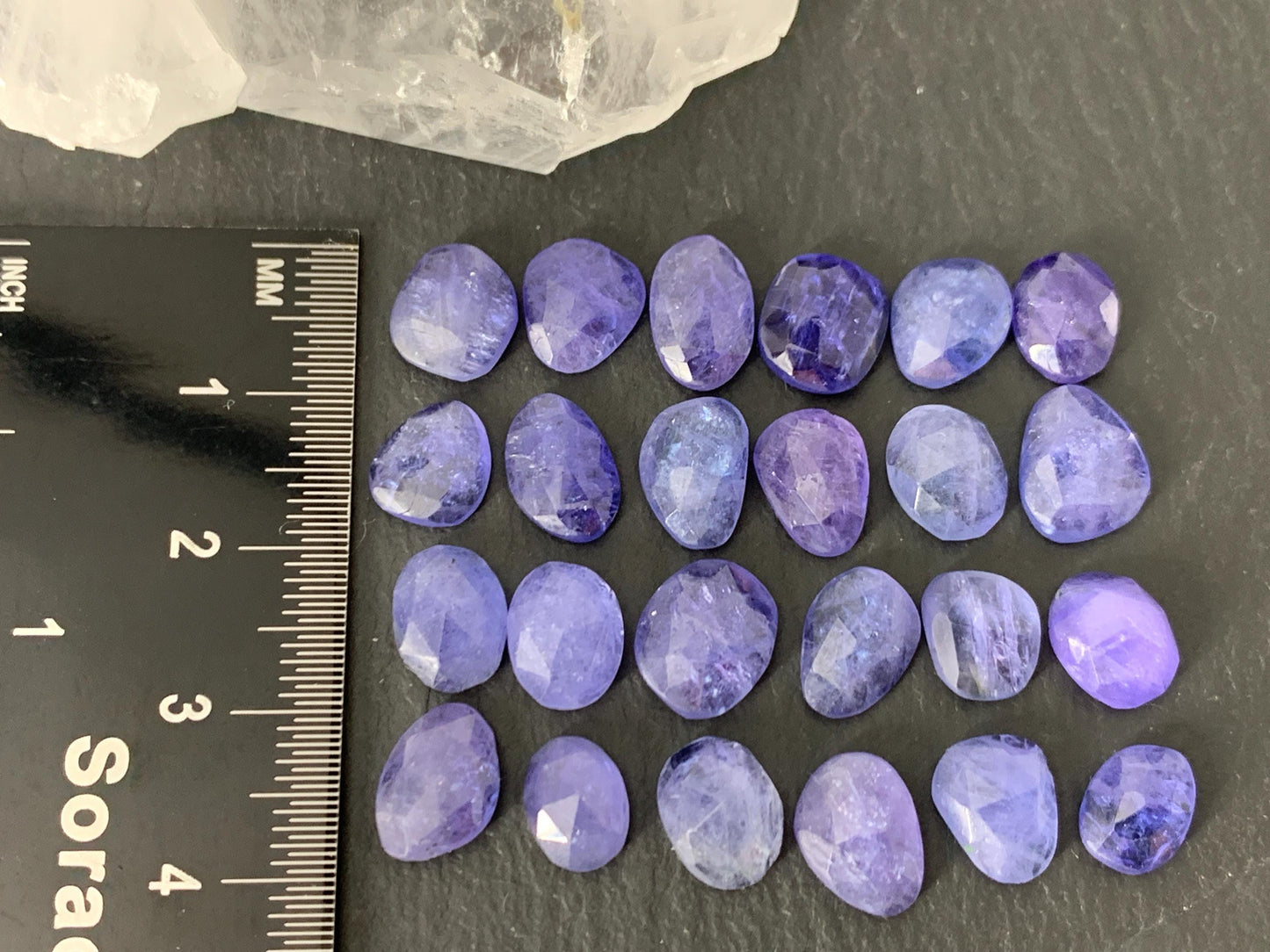 Discounted Damaged Faceted Tanzanite 8-10mm long cabochon
