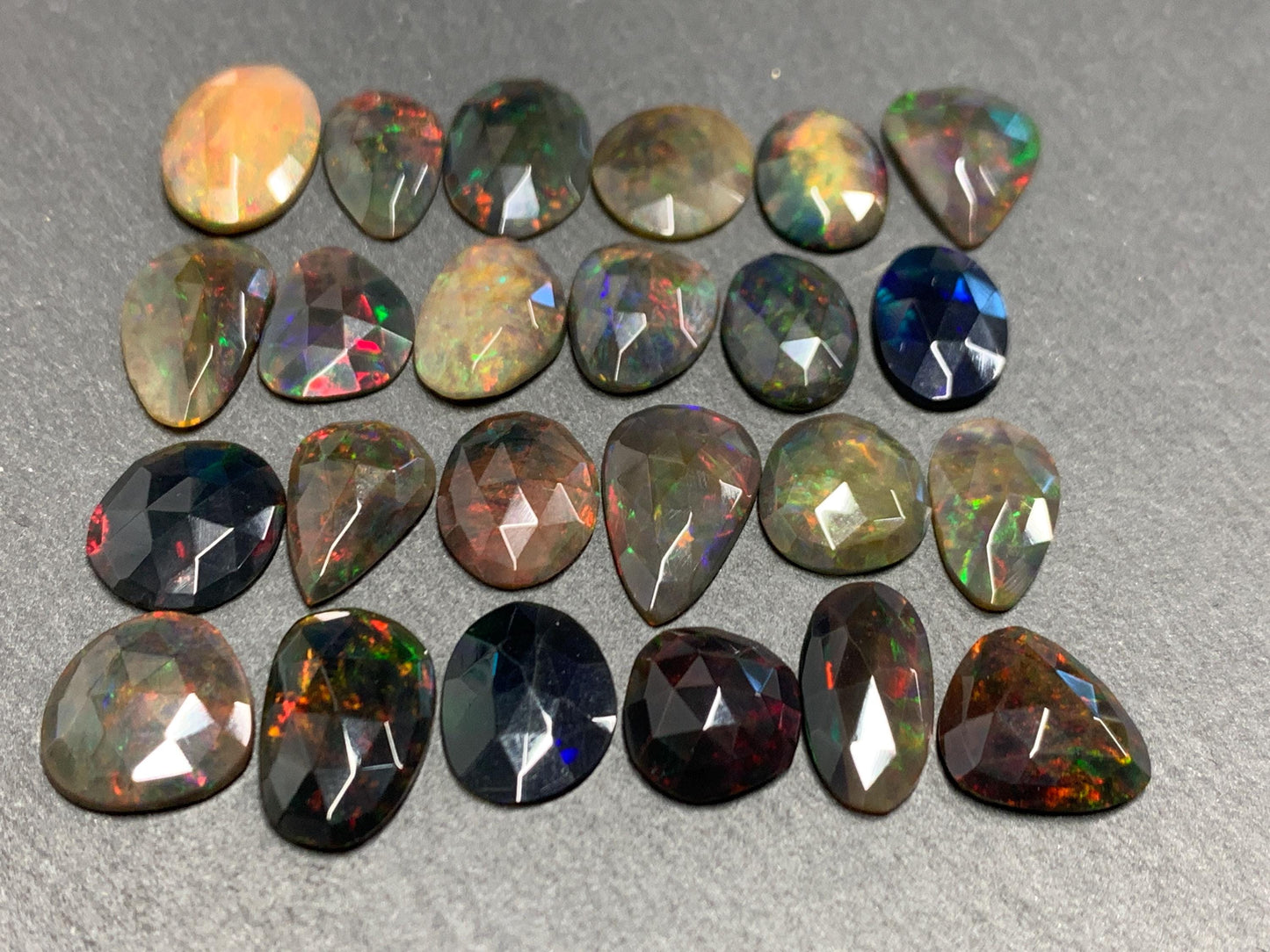 Faceted Black Ethiopian Opal 12-16mm long cabochon