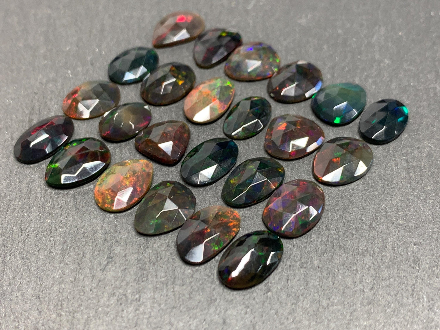 Faceted Black Ethiopian Opal 10-13mm long cabochon