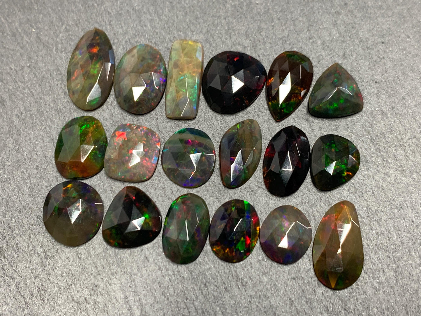 Faceted Black Opal oval 10-16mm long cabochon