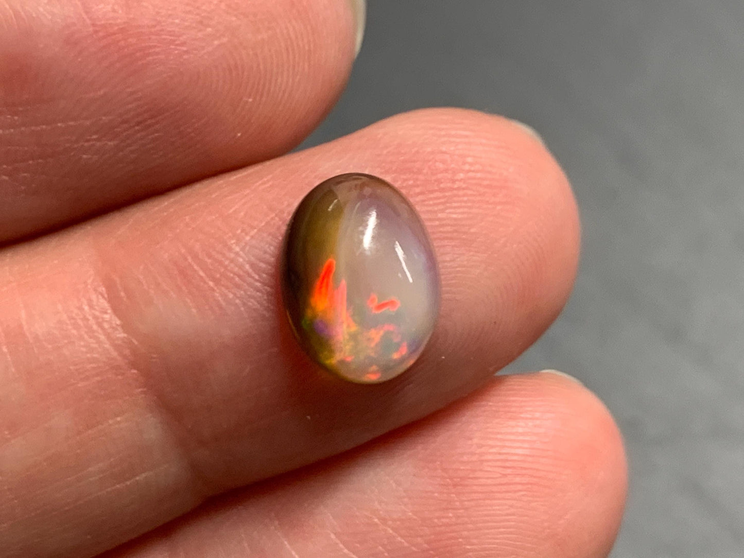 Natural Black Ethiopian Opal oval 7x10x4mm cabochon