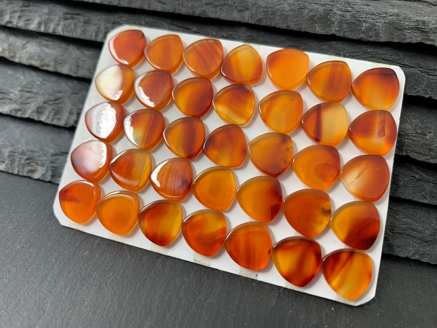 Flat Carnelian curved triangle 10mm cabochon - Calibrated cabochons