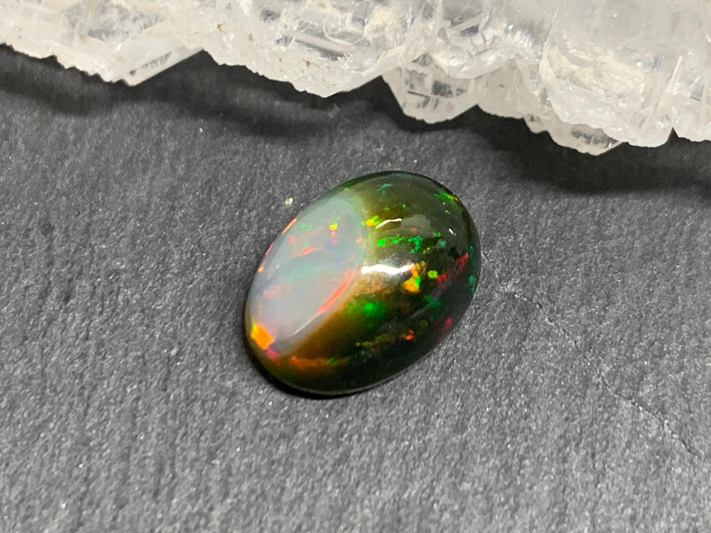 Natural Black Ethiopian Opal oval 8x11x4mm cabochon
