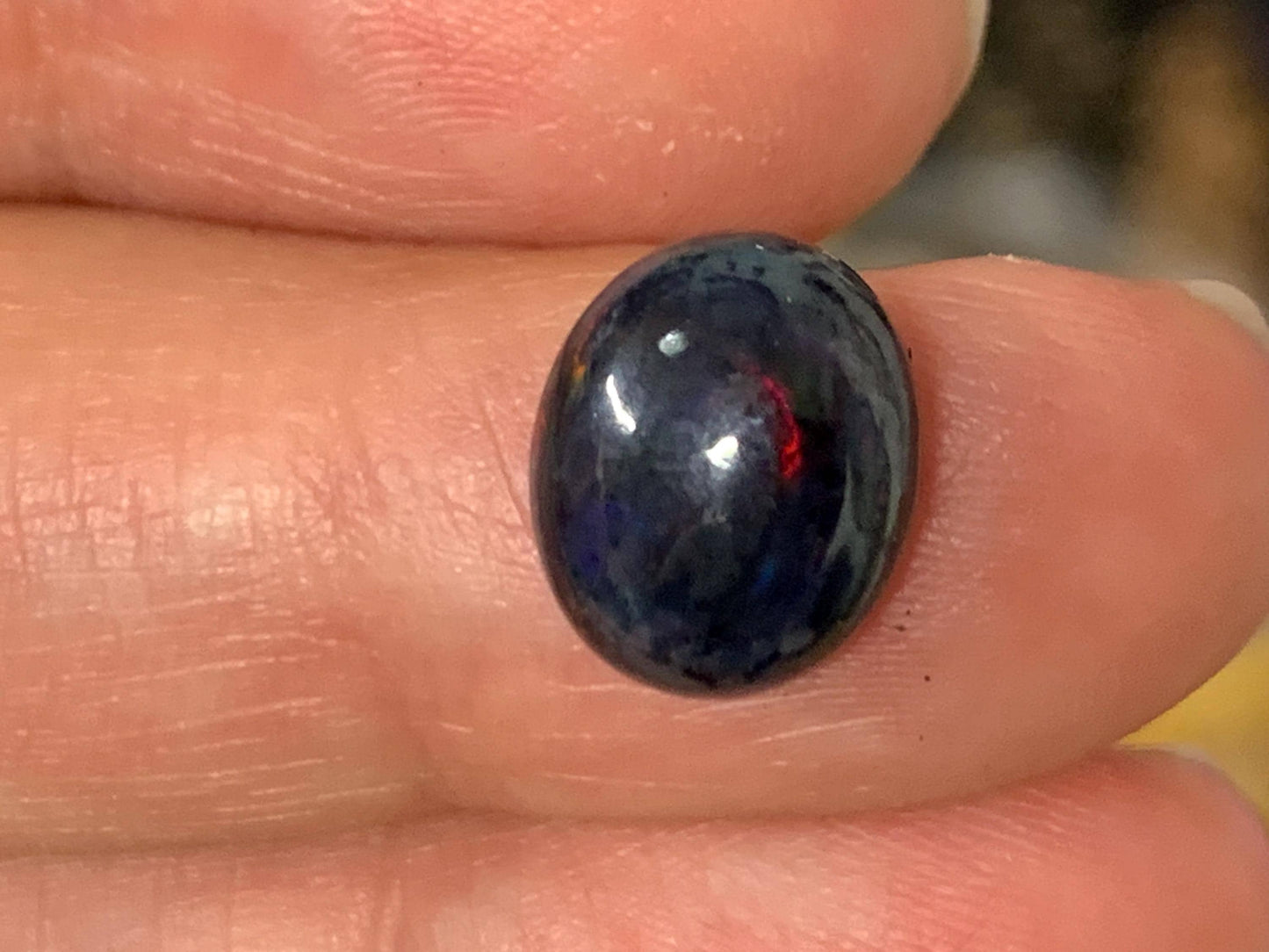 Natural Ethiopian Black Opal 9x11x5mm cabochon