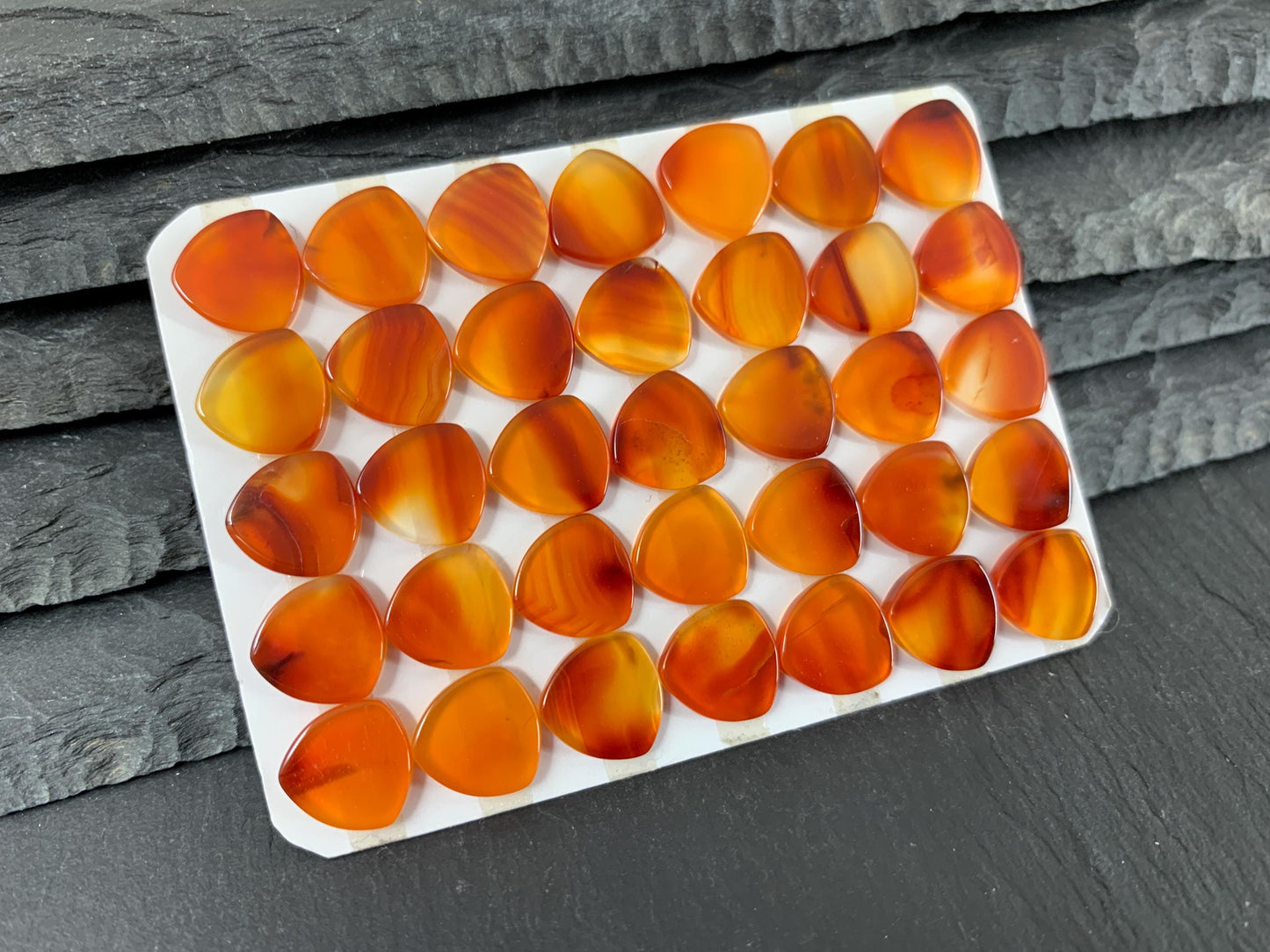 Flat Carnelian curved triangle 10mm cabochon - Calibrated cabochons