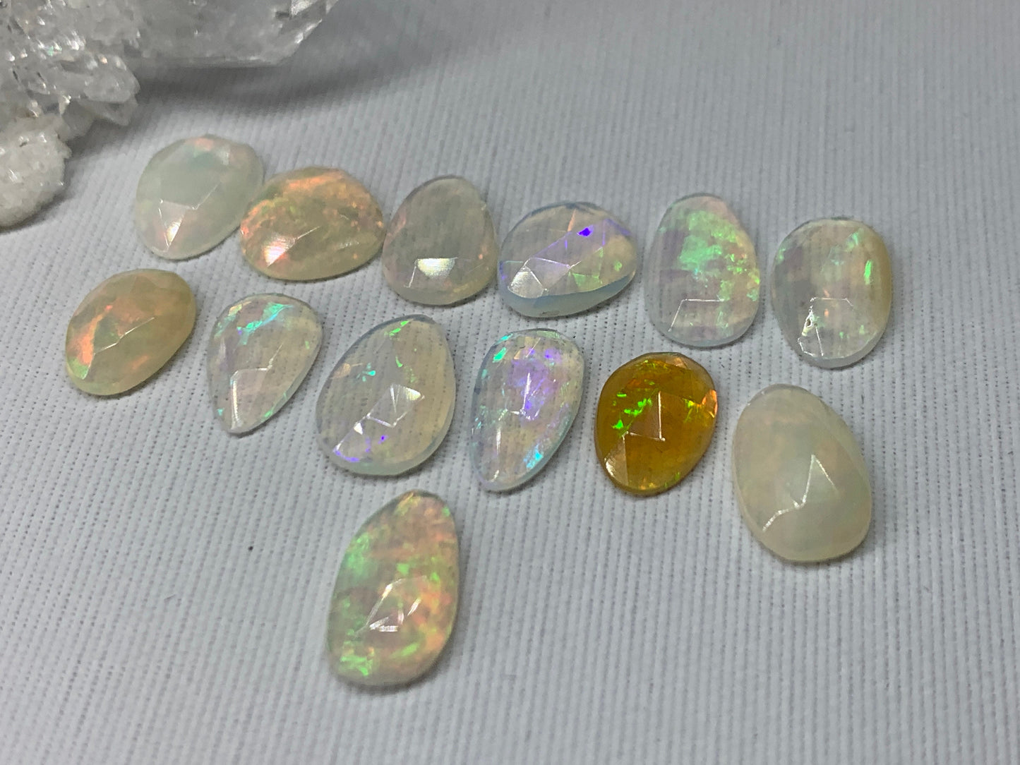 Faceted Ethiopian Opal 10-12mm long cabochon