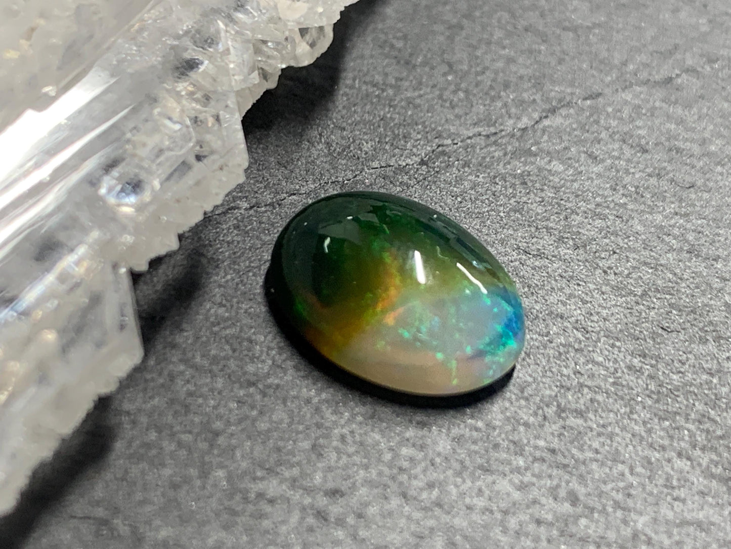 Natural Black Ethiopian Opal oval 9x11x4mm cabochon