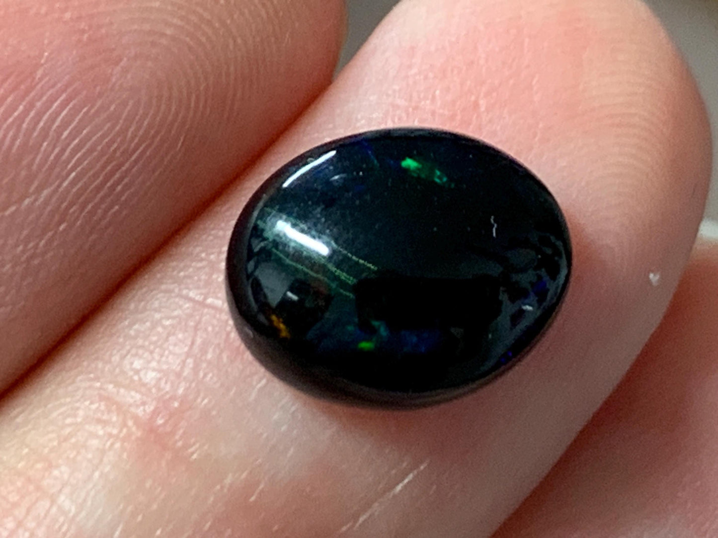 Natural Ethiopian Black Opal 9x11x4mm cabochon