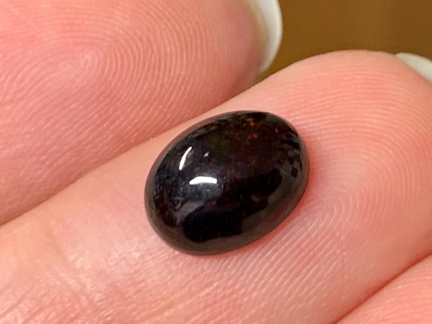 Natural Ethiopian Black Opal 7x9x4mm cabochon
