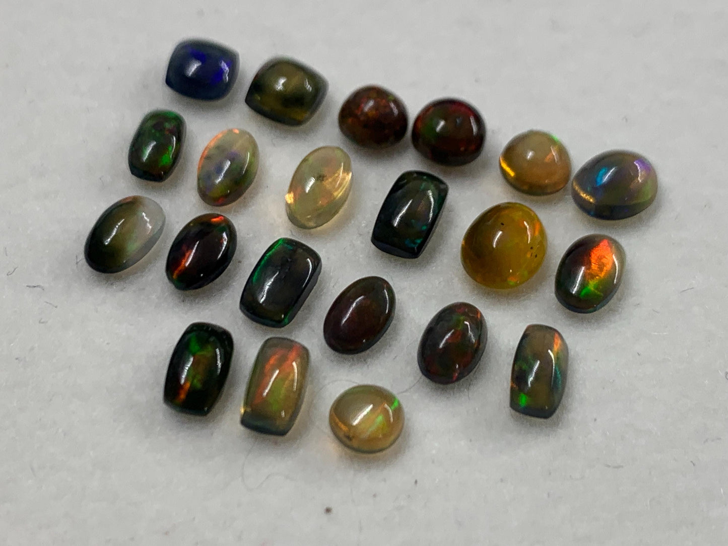 Natural Black Ethiopian Opal oval 4-5mm long cabochon *