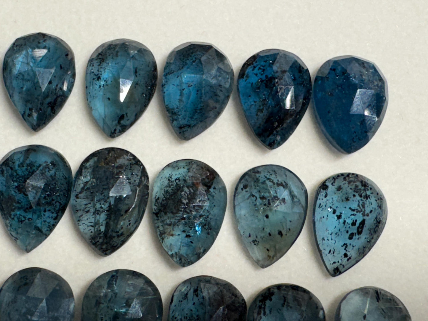 Faceted Moss Kyanite pear 10x14mm cabochon