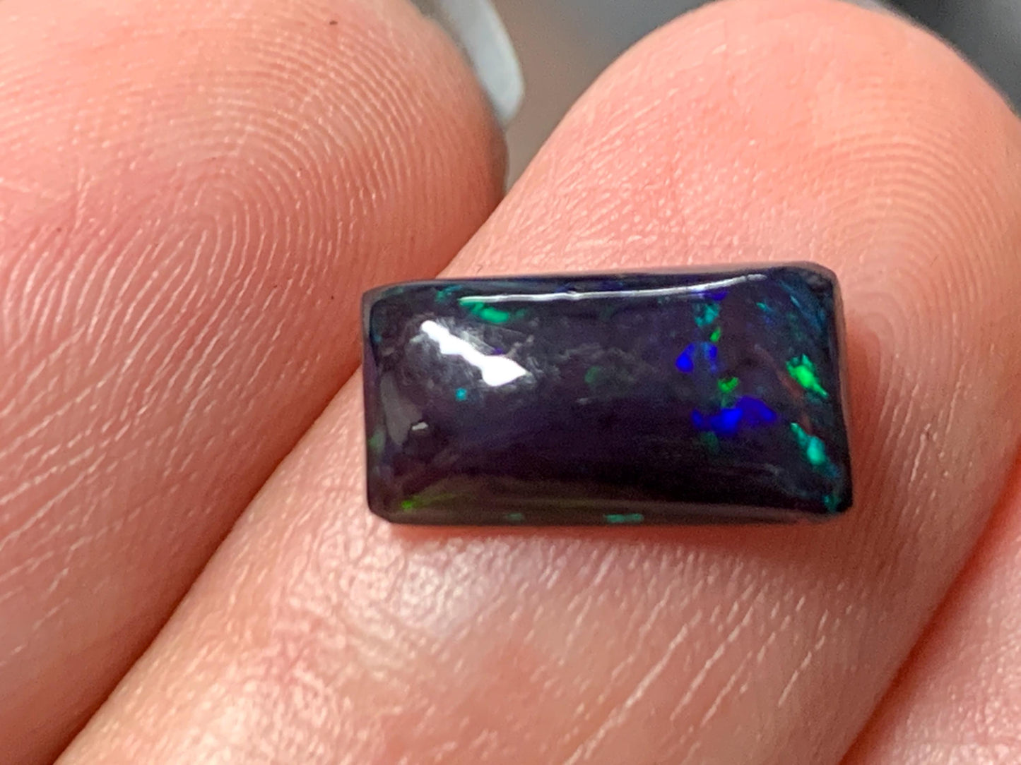 Natural Ethiopian Black Opal 6x11x3mm cabochon