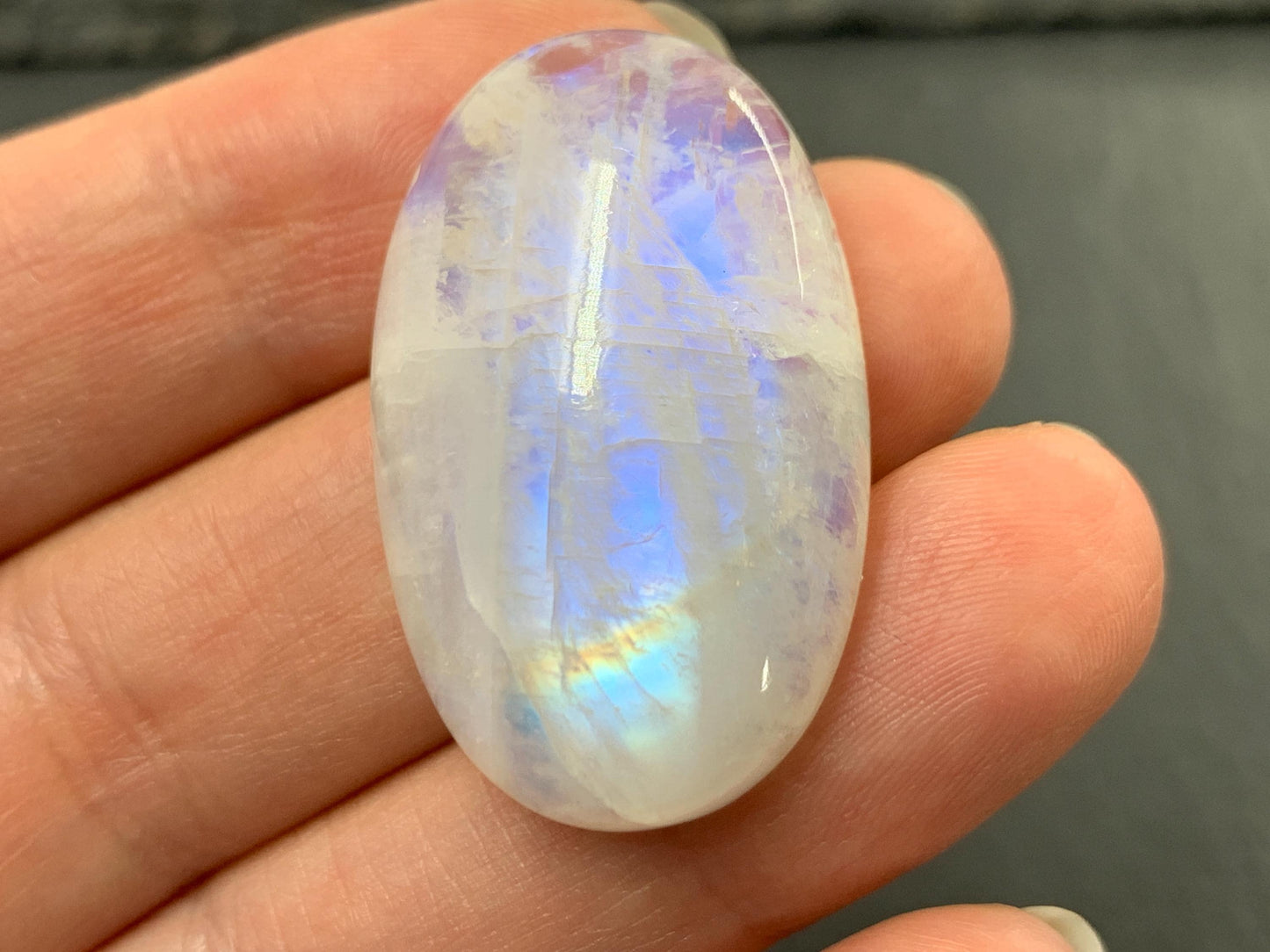 Rainbow Moonstone oval 33x21x9mm cabochon