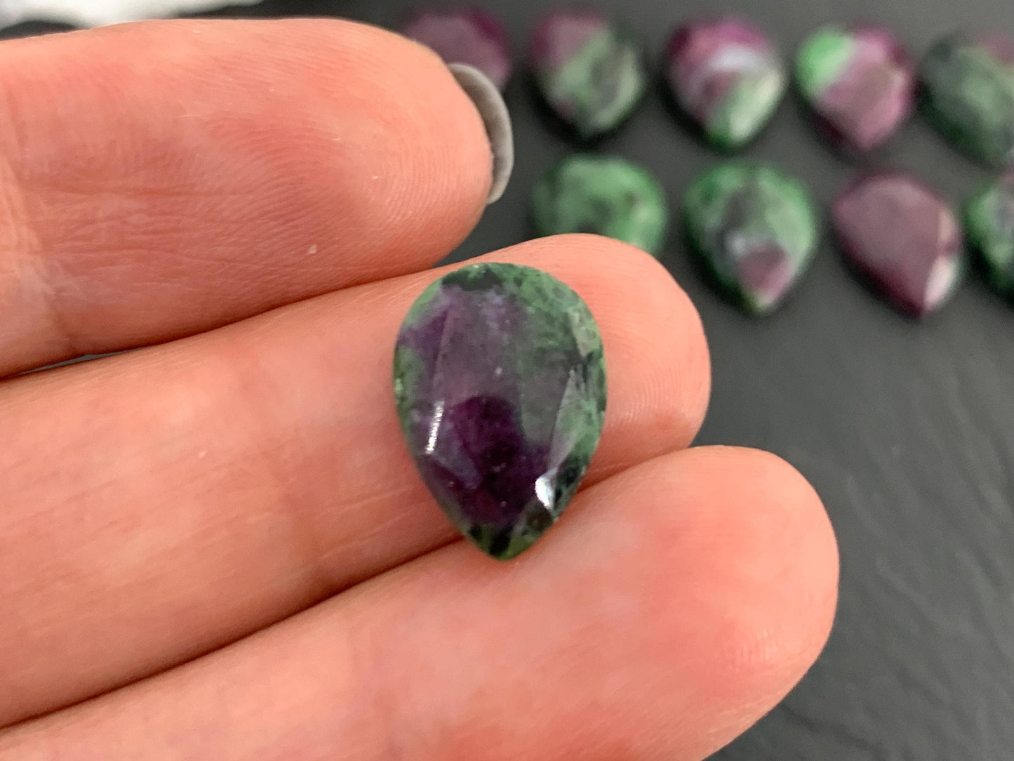 Faceted Ruby Zoisite 10x14mm cabochon.