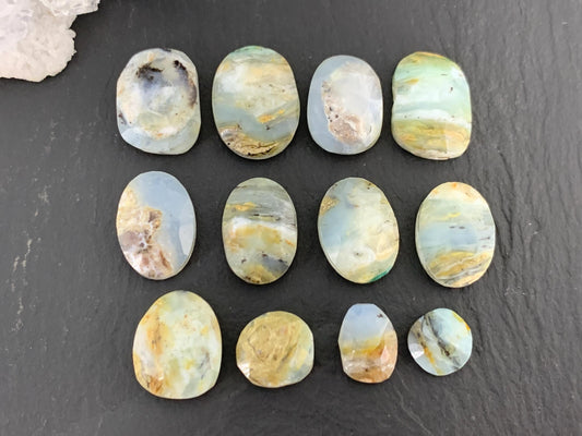 Faceted Peruvian Opal 8-14mm long cabochon.