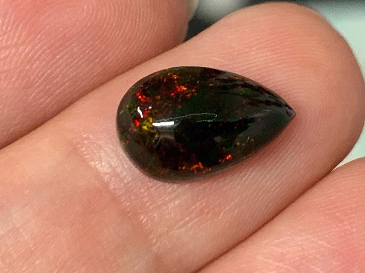 Natural Ethiopian Black Opal 8x12x4mm cabochon