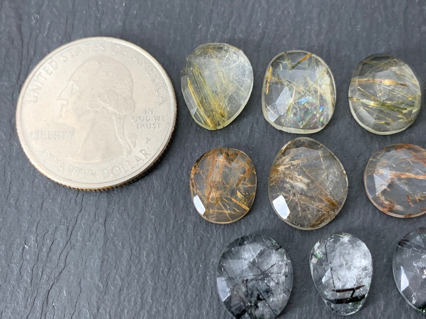 Faceted rutilated quartz oval 10-12mm long cabochon