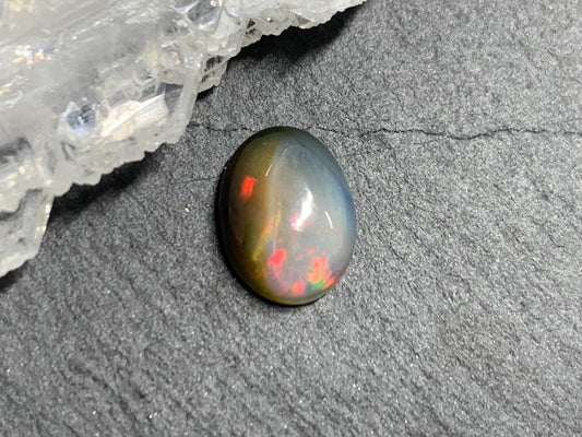 Natural Black Ethiopian Opal oval 7x10x4mm cabochon