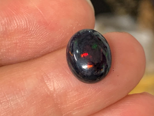 Natural Ethiopian Black Opal 9x11x5mm cabochon