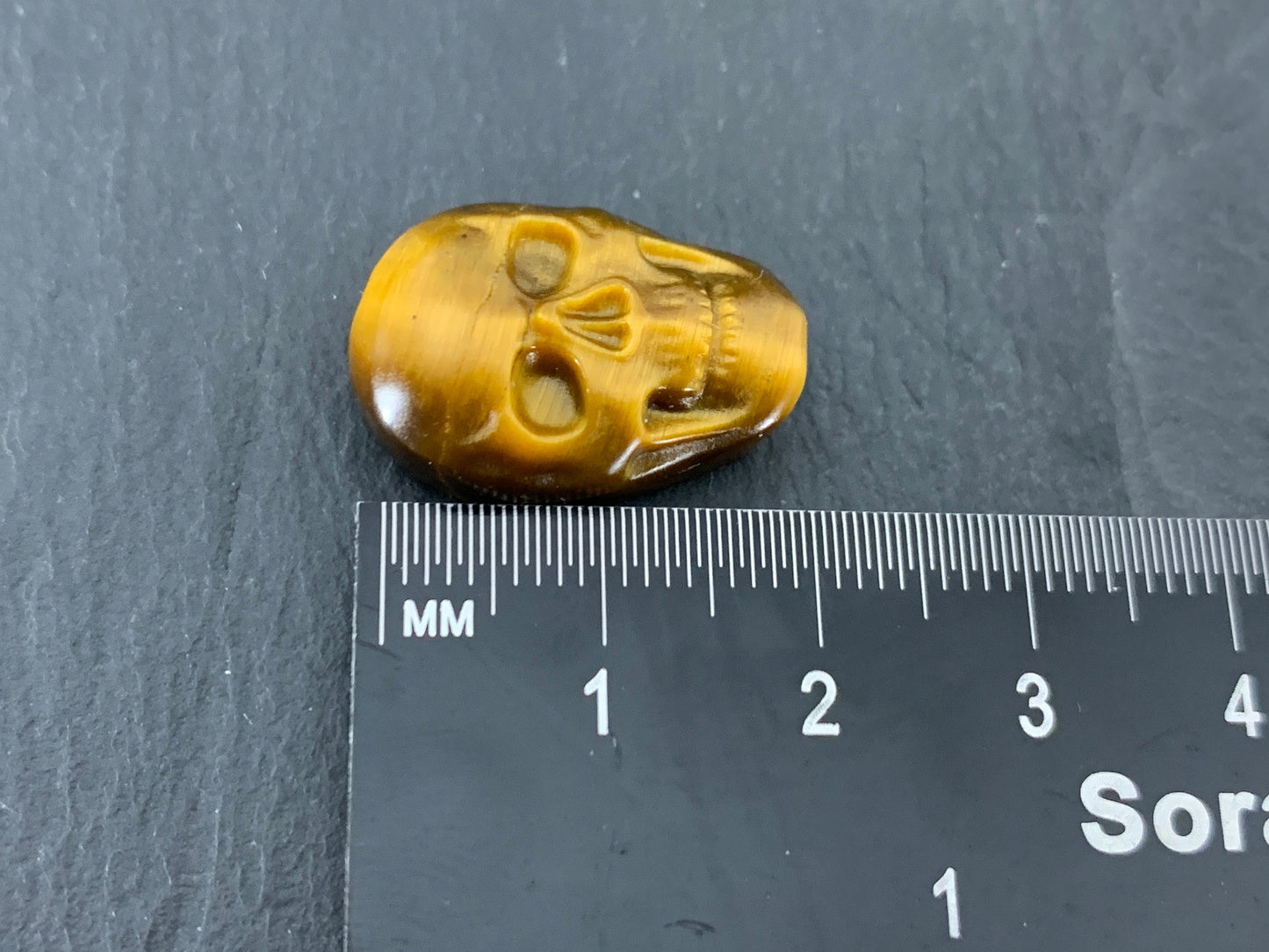 Tiger eye skull 15x22mm cabochon