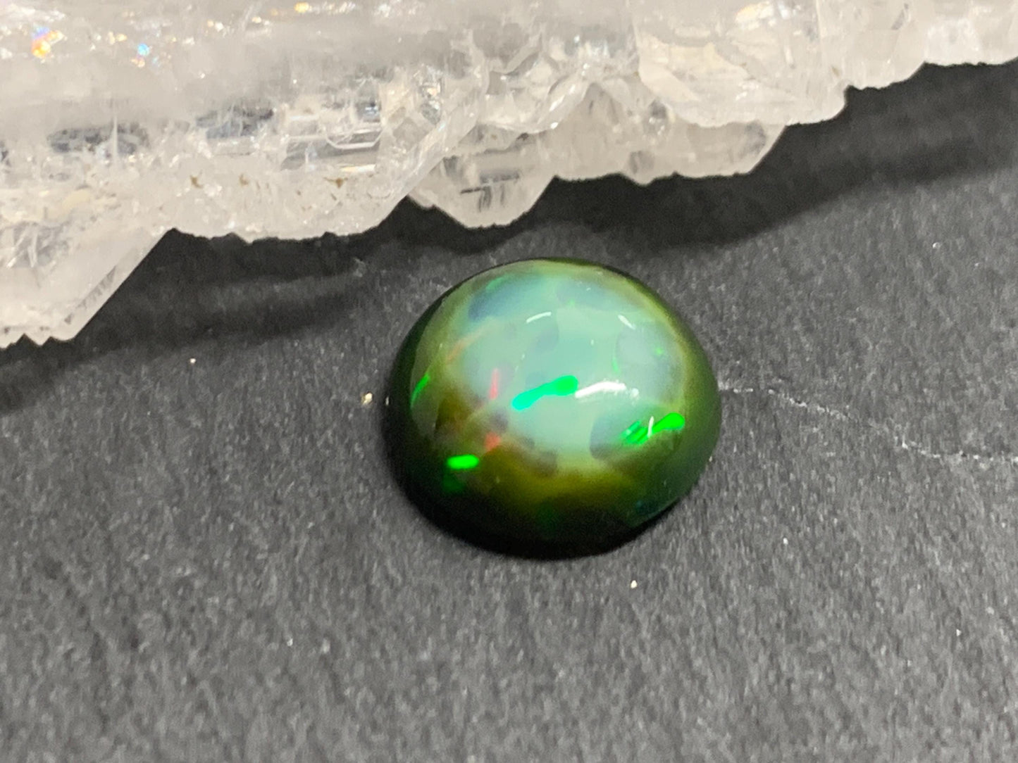 Natural Black Ethiopian Opal round 9.5x9.5x4mm cabochon