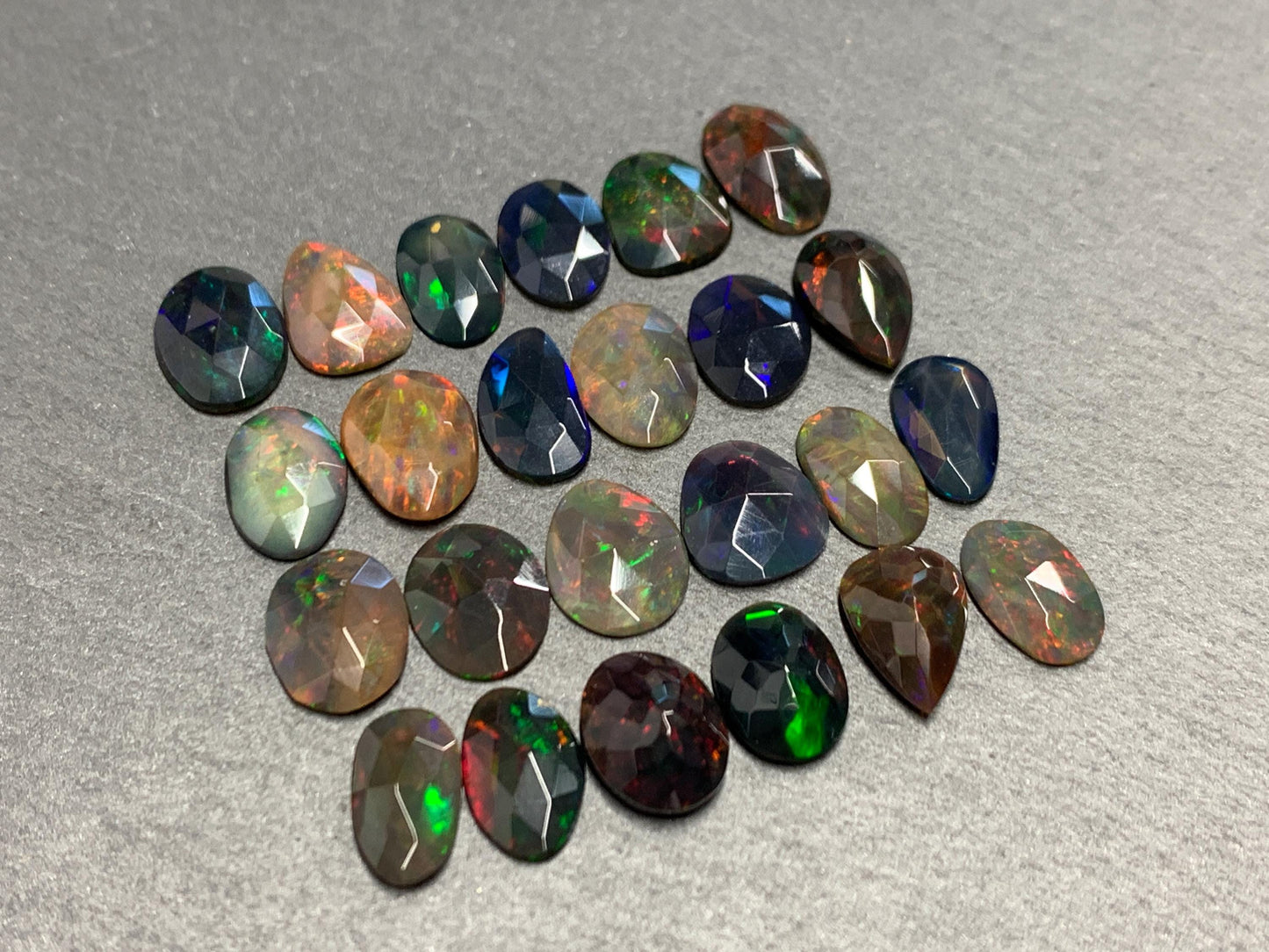 Faceted Black Ethiopian Opal 10-11mm long cabochon