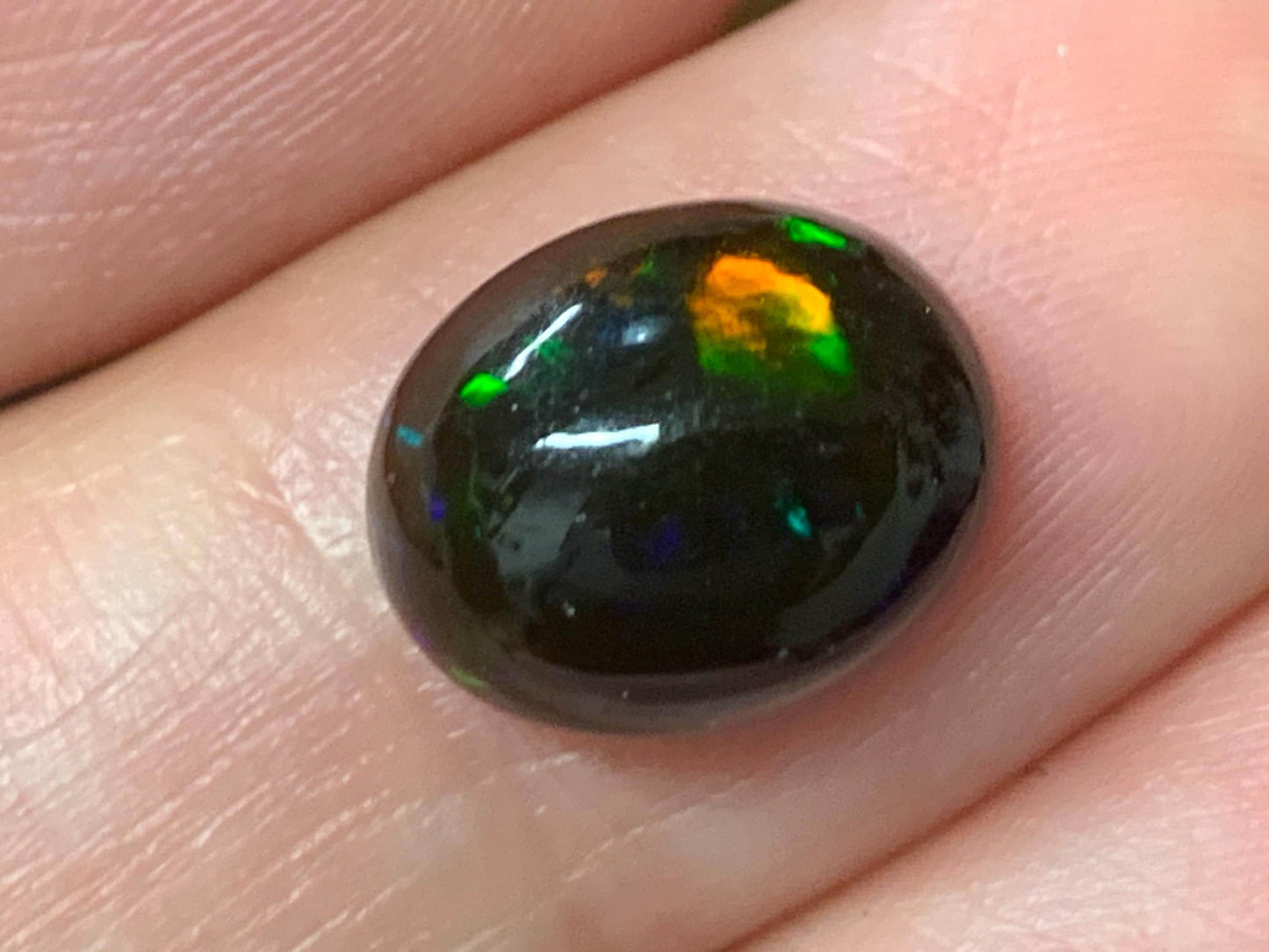 Natural Ethiopian Black Opal 9x11x5mm cabochon