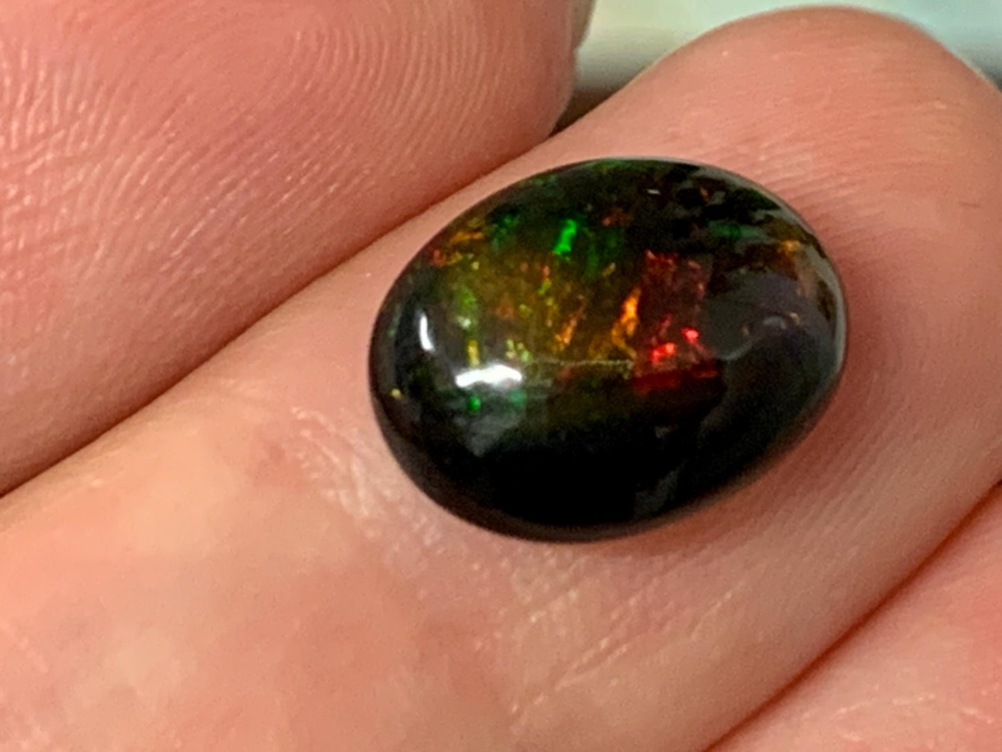 Natural Ethiopian Black Opal 9x12x5mm cabochon